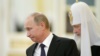 Президент России Владимир Путин (слева) и Московский патриарх Кирилл (архивное фото)