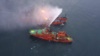 Спасательное судно во время пожарной операции после аварии с участием двух танкеров, которые загорелись у побережья Крыма, 22 января 2019 года