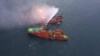 Спасательное судно проводит операцию по тушению пожара на двух танкерах, загоревшихся у побережья Крыма, 22 января 2019 года