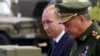 Президент России Владимир Путин и министр обороны России Сергей Шойгу